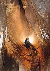 Abseiling into cavern